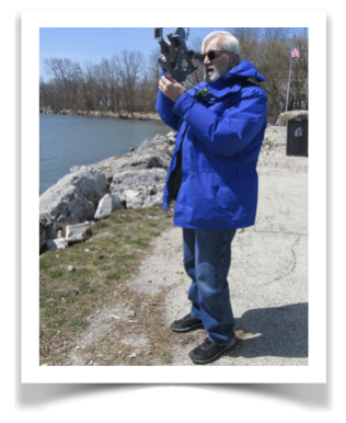 Jesse Bowen is seen taking a celestial sight with his sextant from Waukegan Harbor on Lake Michigan, April 2020..